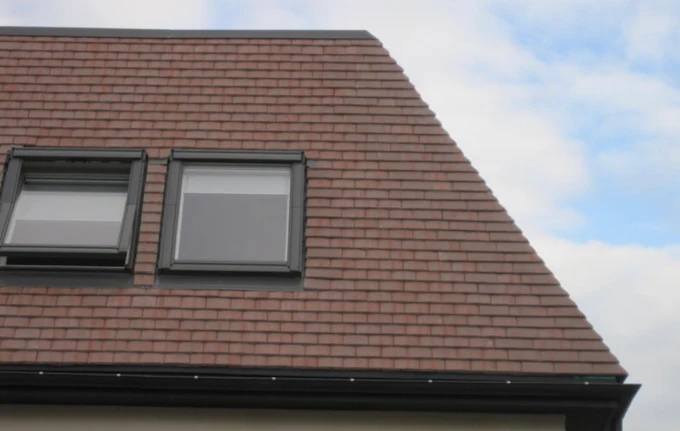 Close up of tiled slope with Velux windows