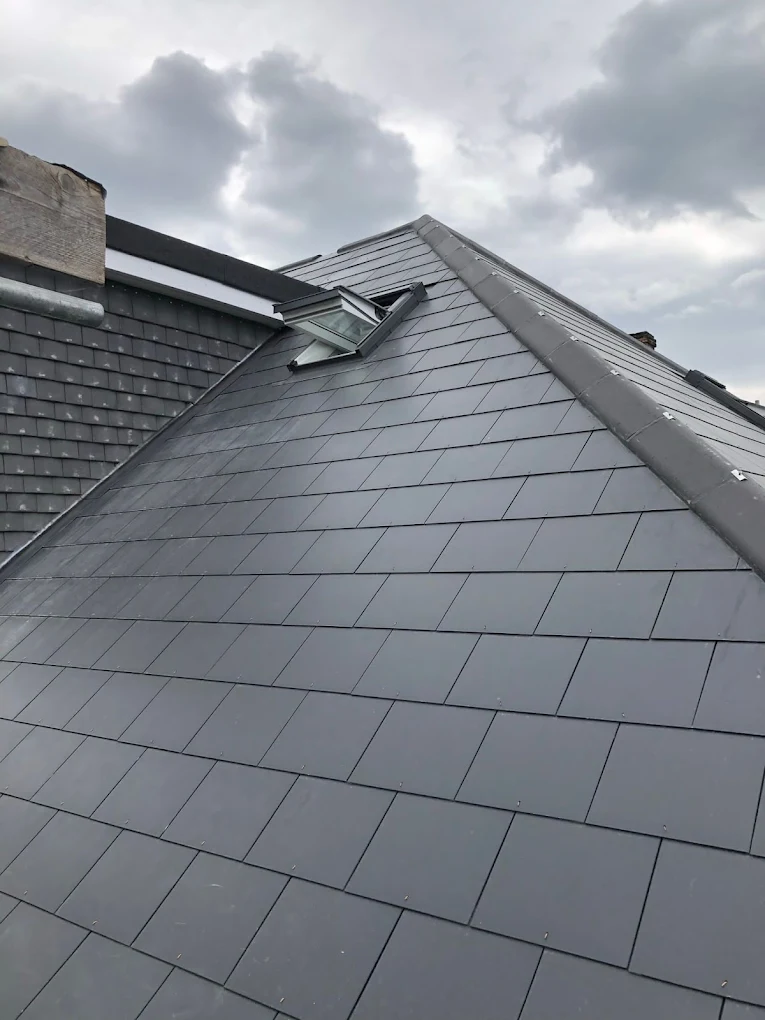 Close up of clean red tiled slope with Velux windows